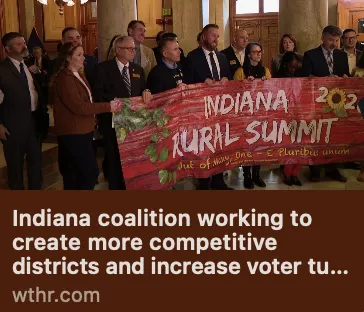Image of Indiana Rural Summit candidates at the statehouse holding a banner that says "Indiana Rural Summit"